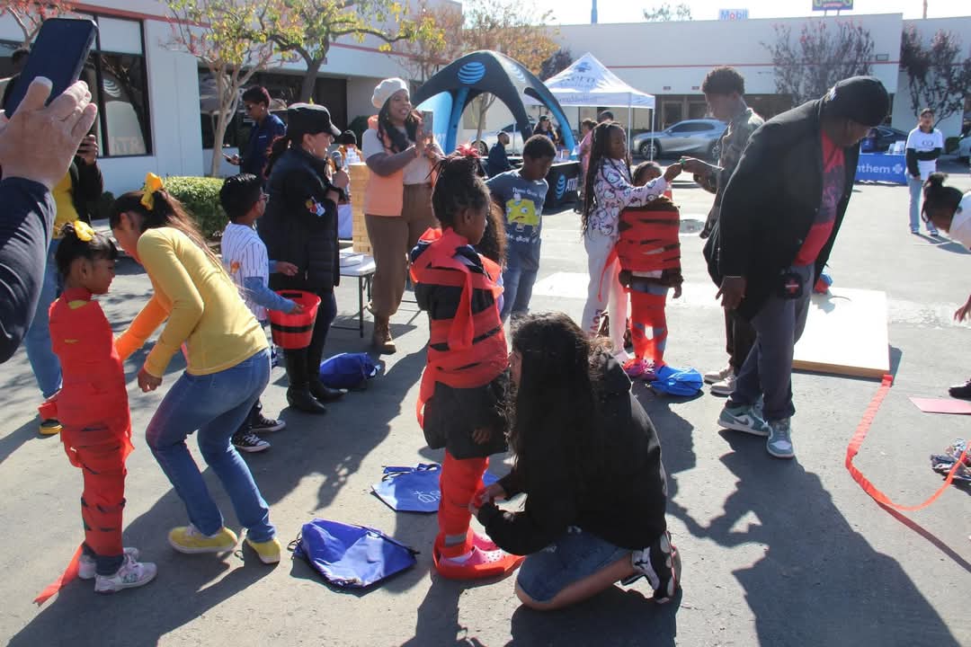 Families participating in a community outreach activity