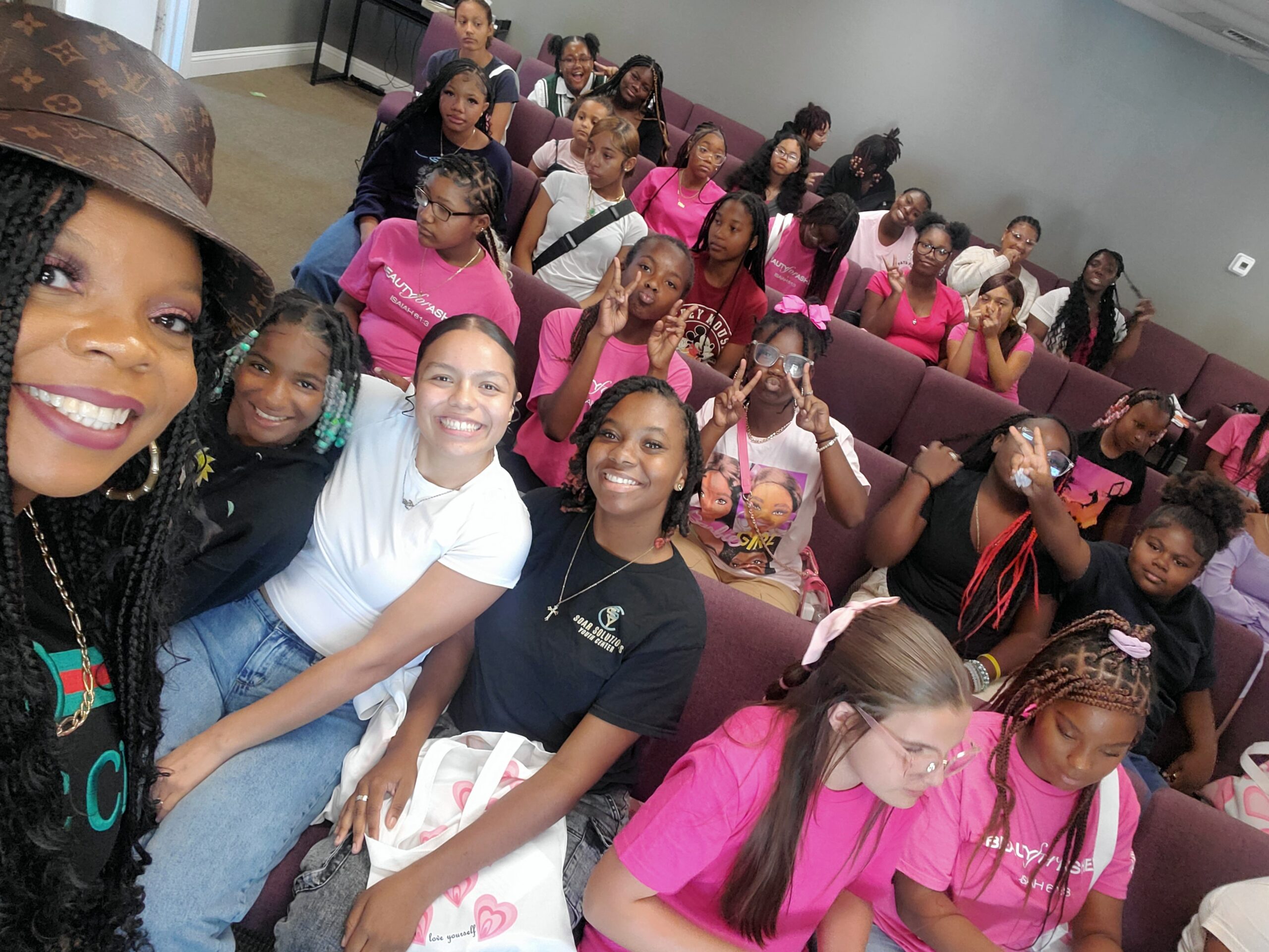 Youth and volunteers gathered during a Charmed and Chosen program